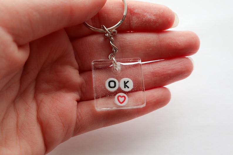 Ok 100/% handmade and made to order this adorable keychain is perfect for any quirky fun key or purse nont This item is made from clear
