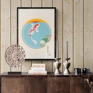 May include: A framed print of a koi fish swimming in a circle with water lilies and Japanese text. The print is on a wooden shelf with two candlesticks, a decorative plate, and three books.