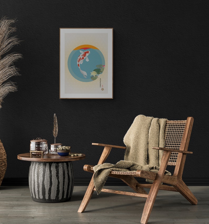 May include: A framed print of a koi fish swimming in a circle with water lilies. The print is hanging on a black wall above a wooden chair with a woven seat and a beige throw blanket.