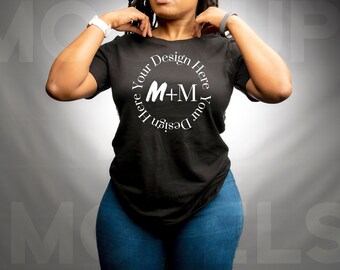 May include: A black t-shirt with a white circle design that says "Design Your Here M+M Your Design Here".