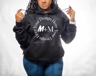 May include: Black hooded sweatshirt with a white circle design that says "Design Your Here M+M Here Your Design".