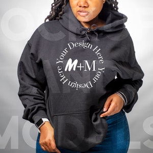 May include: A black hooded sweatshirt with a white circle design that says "Design Your Here M+M Here Your Design".