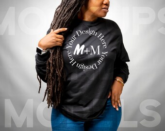 May include: A black long-sleeve shirt with a white circle design that says "Design Your Here M+M Your Design Here".