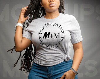 May include: A gray t-shirt with a black circle design that says "Design Your Here M+M Your Design Here".