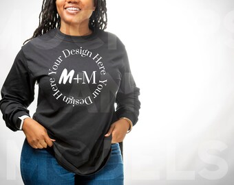 May include: A black long-sleeve shirt with a white circle design that says "Design Your Here Your Design Here" with the letters M+M in the center.
