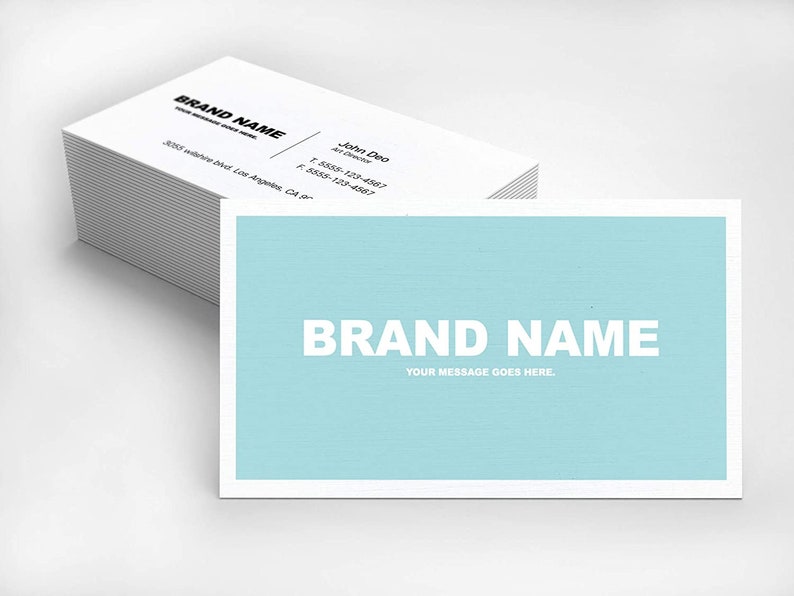 May include: A stack of light blue business cards with the text "BRAND NAME" and "YOUR MESSAGE GOES HERE." printed in white.
