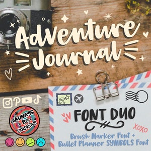 May include: An image with the words "Adventure Journal" in a whimsical font. Below, a paper with "FONT DUO" and "Brush Marker Font + Bullet Planner SYMBOLS Font" is held by a clip. Decorative elements include hearts, stars, and social media icons.