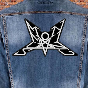 May include: A black and white embroidered patch featuring a pentagram and the word "SLAYER" in a stylised font.