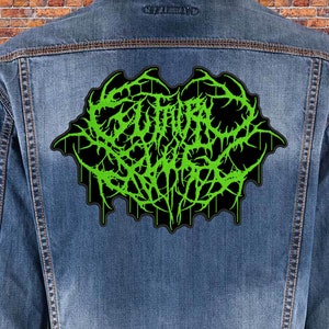 May include: Green and black embroidered patch with the text "GUTTED" in a gothic font.