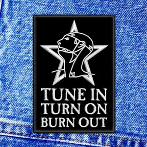 May include: Black and white embroidered patch with a star and a stylized human head. The text "TUNE IN TURN ON BURN OUT" is below the star.