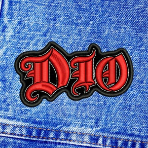 May include: Red embroidered patch with the word "DIO" in a gothic font style, on a blue denim background.