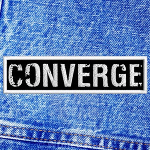 May include: A black and white patch with the word "CONVERGE" in white letters on a blue denim background.