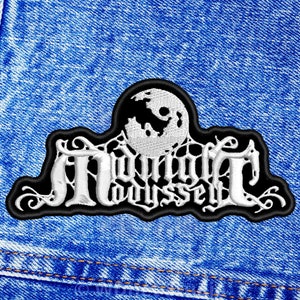 May include: A black and white embroidered patch with the text "Midnight Odyssey" and a white moon design. The patch is on a blue denim background.