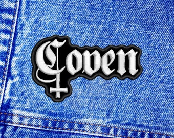 May include: Black and white embroidered patch with the word "Coven" in a gothic font. The patch features a stylized crescent moon and a cross.