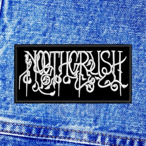 May include: A black patch with white embroidered lettering that reads "Noothgrush". The patch is on a blue denim background.