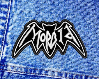 May include: Black and white embroidered patch of a bat with the word "MORBID" written in white on the bat's body.