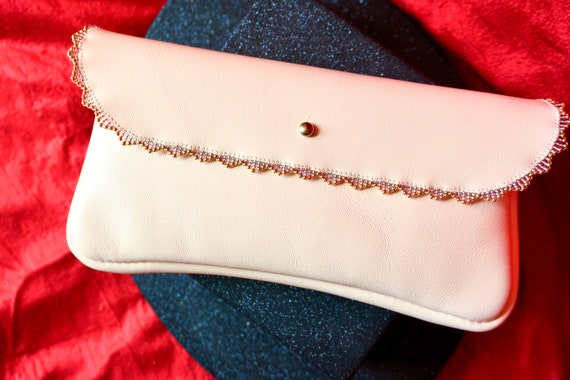 blush leather clutch