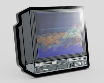 May include: A grey enamel pin shaped like a vintage television set with a black border. The screen displays a colorful, stylized graphic of figures in motion. The base features detailed control panels with small buttons and a horizontal light bar.