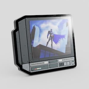 May include: A gray, rectangular enamel pin shaped like a vintage television set. The screen displays a graphic of a caped figure standing on a rooftop against a cloudy sky. The television frame features detailed control panels with buttons and vents.