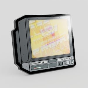 May include: A dark gray enamel pin shaped like a vintage television set. The screen displays a yellow and white graphic with stylized text. The frame features detailed black outlines, control buttons, and a small rectangular accent in red and blue.