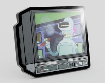 May include: A rectangular enamel pin shaped like a vintage television set with a dark gray frame. The screen displays a cartoon robot character with a metallic body, holding a cigar, set against a purple background with various control buttons.
