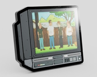May include: A dark gray, retro-style television set pin featuring a screen display of four animated characters standing in a backyard with a wooden fence. The television casing has detailed control panels, buttons, and vents depicted in a flat, graphic illustration style.