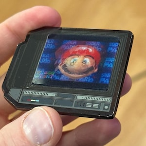 2.5&quot; Lenticular 64 Red Hat Plumber CRTV Enamel Pin