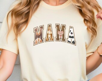 May include: A light yellow t-shirt with the word "MAMA" in brown letters. Each letter is filled with a different cartoon animal, including a bear, a panda, and a llama.