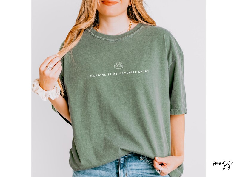 Show your love for the game with our “Mahjong Is My Favorite Sport” shirt! Perfect for Filipina moms, dads, and mahjong enthusiasts, this comfy Comfort Colors® tee is great for game nights or casual wear. A fun gift for players of American or traditional mahjong — stylish and spirited!