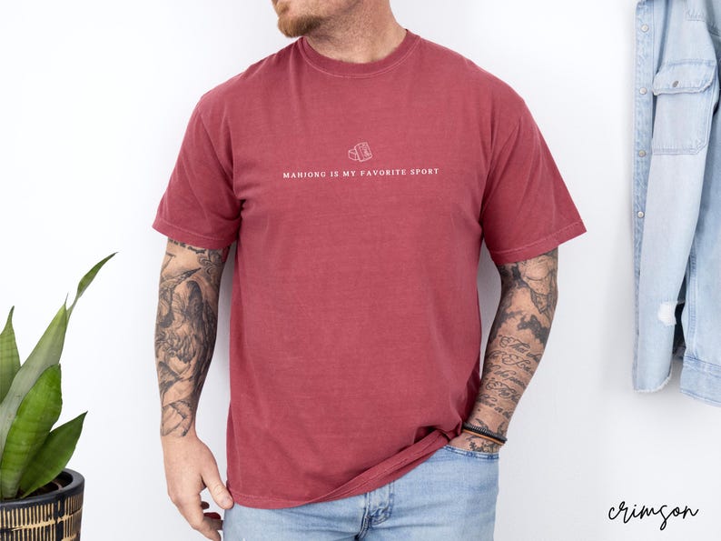 Show your love for the game with our “Mahjong Is My Favorite Sport” shirt! Perfect for Filipina moms, dads, and mahjong enthusiasts, this comfy Comfort Colors® tee is great for game nights or casual wear. A fun gift for players of American or traditional mahjong — stylish and spirited!