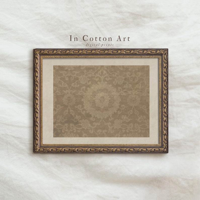 A framed picture with a decorative border is displayed against a white background.