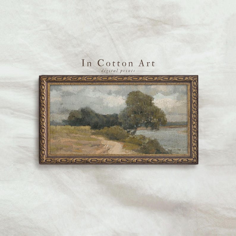 The image is a framed painting depicting a landscape scene with a river, trees, and a cloudy sky.