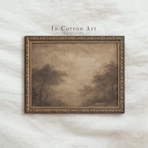 May include: A framed landscape painting in sepia tones. The artwork depicts trees and a hazy sky. The frame is ornate with a gold finish. The text "In Cotton Art digital prints" is visible at the top.