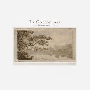 May include: Sepia-toned landscape print featuring a tree on the left and a body of water reflecting the sky and distant trees. The print is framed in a white border, with the text "In Cotton Art - digital prints" at the top.