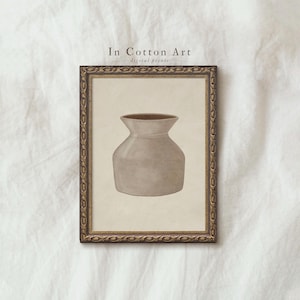 a framed print of a vase against a white background.