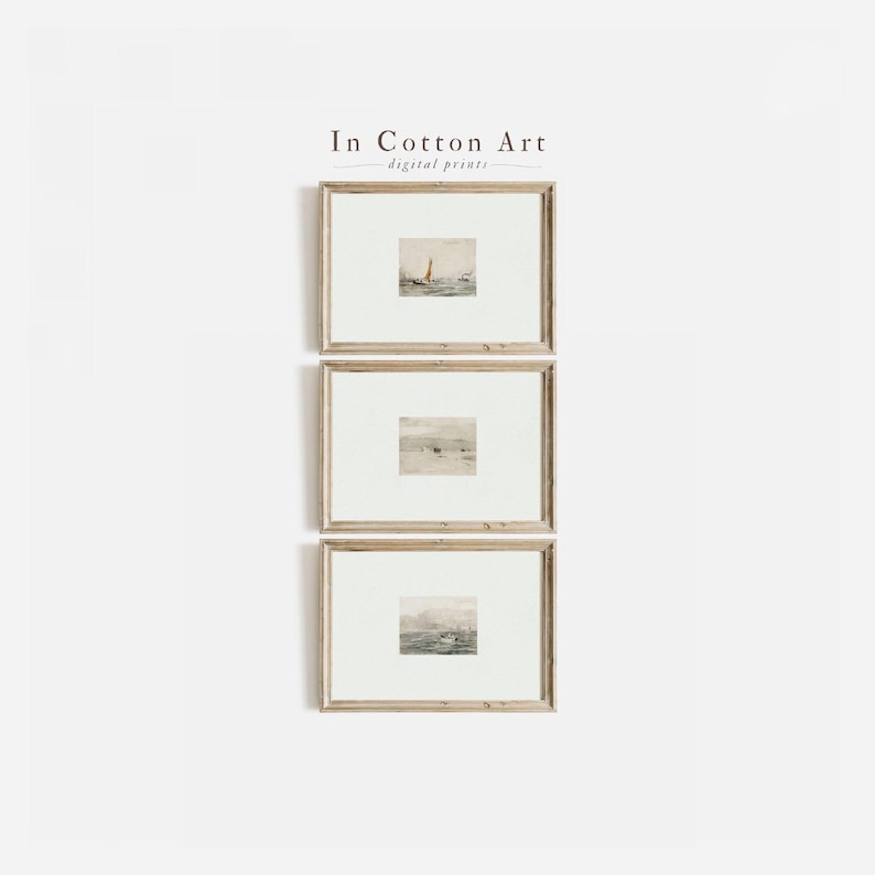 three framed artworks displayed on a white wall.