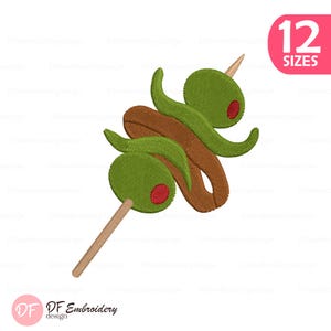 May include: An embroidery design featuring two green olives with red centers skewered on a light brown toothpick, intertwined with a brown, curved, elongated shape. A pink rectangular badge in the corner displays the text 12 SIZES.