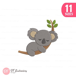 May include: An embroidered design of a grey koala bear sleeping on a brown tree branch with green leaves. The image includes the text "11 SIZES" in a pink oval.