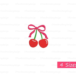 May include: Two red cherries with green stems and a pink bow tied around the stems.