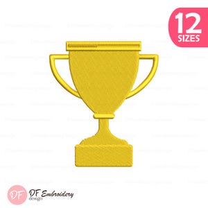 May include: A golden trophy design with a textured appearance, featuring a cup-shaped body, curved handles, and a rectangular base. The image includes the text "12 SIZES" in a pink circle and the "DF Embroidery design" logo.