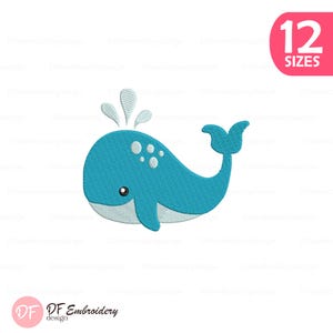 Puede incluir: Un diseño de ballena bordada azul con detalles blancos, incluyendo chorros de agua y manchas. El diseño está acompañado por el texto "12 SIZES" en un círculo rosa. El logotipo de DF Embroidery está en la esquina inferior izquierda.