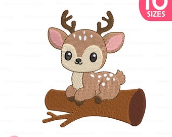 May include: A cartoon illustration of a baby deer with brown fur, white spots, and antlers, sitting on a brown log. The deer has large black eyes and pink inner ears. A pink circle with the text "10 SIZES" is in the upper right corner.