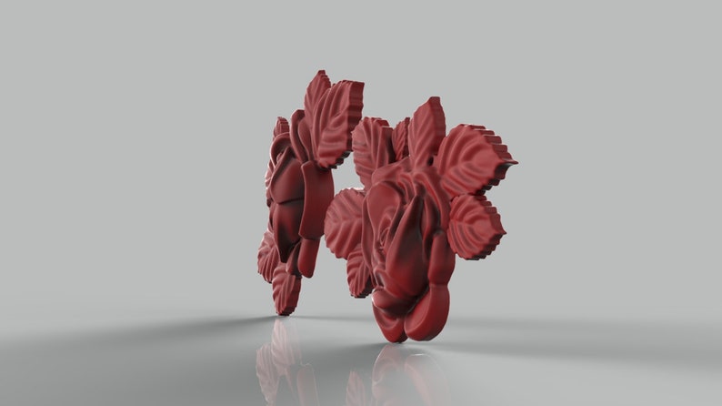 May include: Two red rose flower embellishments with detailed petals and leaves.