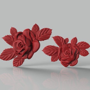 May include: Two red rose flower embellishments with leaves. The roses are 3D and have a realistic look.