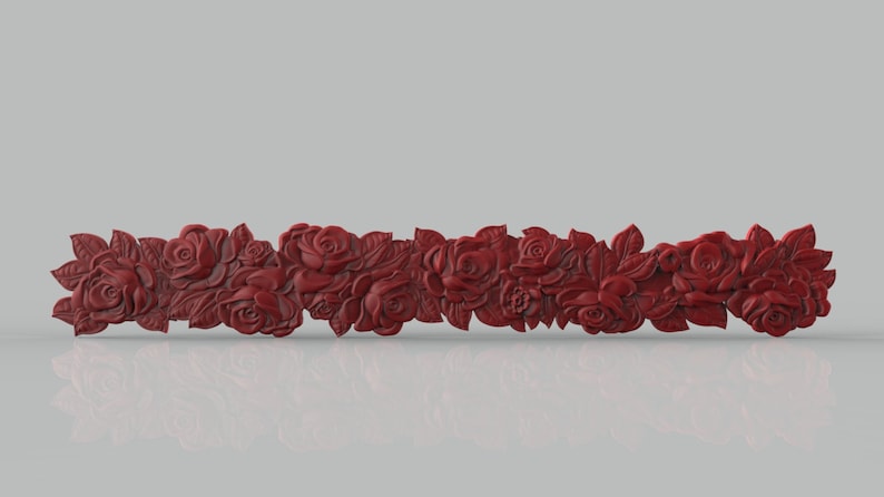 May include: A decorative red floral garland with roses and leaves. The garland is made of a smooth, sculpted material and is perfect for adding a touch of elegance to any home decor.