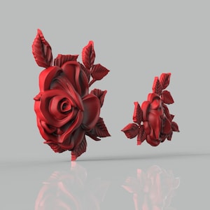 May include: Two red 3D printed rose sculptures. The larger rose is in full bloom with leaves, while the smaller rose is partially open with leaves.