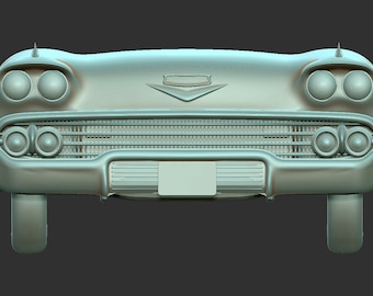 May include: Front view of a vintage, light blue, classic car with a chrome grill and headlights. The car has a chrome bumper and a chrome emblem on the hood.