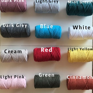 May include: A collection of 18 spools of cotton cord in various colors, including petrol blue, pink, beige, yellow, black, orange, dark pink, light grey, mint green, dark grey, blue, white, cream, red, light yellow, light pink, green, cinnamon, burgundy, aqua green, milky brown, navy blue, grey, and purple.