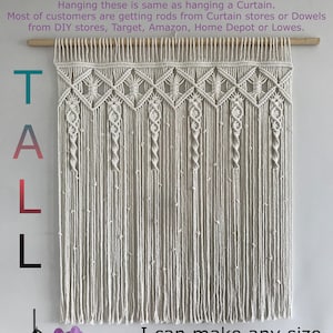 May include: A white macrame wall hanging with a geometric pattern. The hanging is 35 inches wide and 39 inches tall. The text "TALL" is written on the left side of the image. The text "I can make any size you want. Contact me!" is written at the bottom of the image.