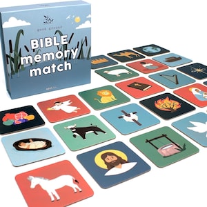 May include: A Bible Memory Match game with a blue box featuring the text "BIBLE memory match" and illustrations of reeds and a sun. The game includes square cards with various biblical images, such as a lion, angel, and Jesus.